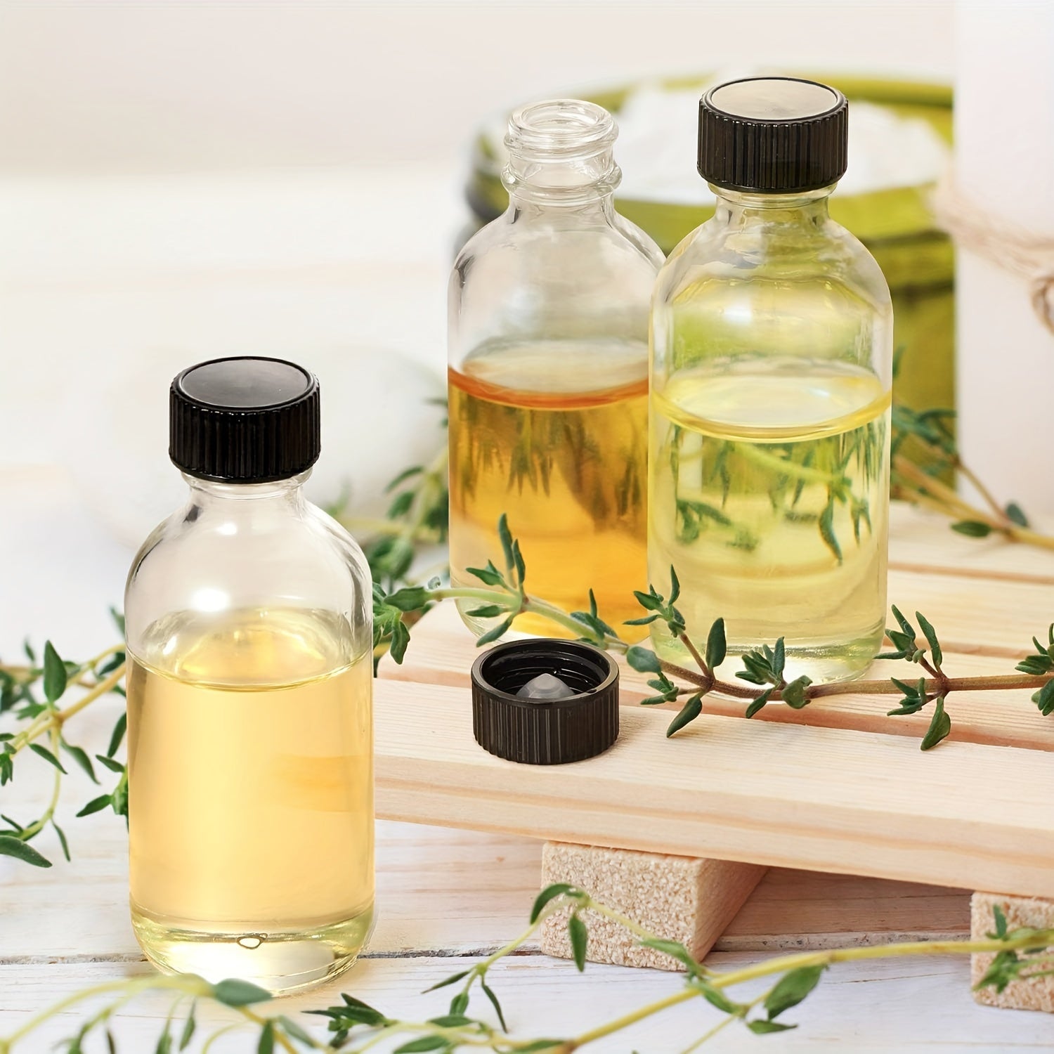 12 Mini 2oz Clear Glass Bottles with Lids and Stainless Steel Funnels for Juice Wellness Shots and Liquor