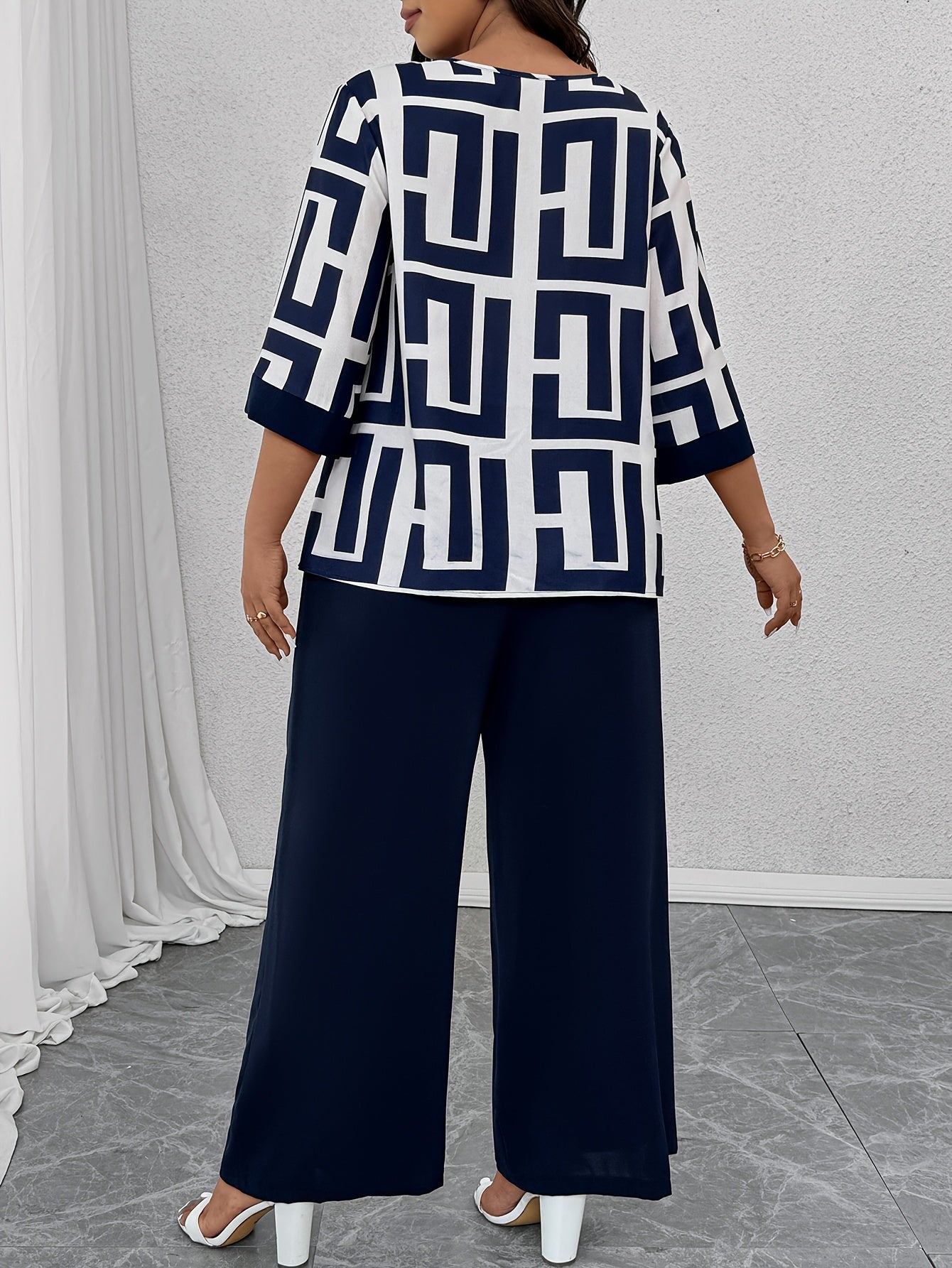 Conjunto de dos piezas para mujer con estampado geométrico, top de escote en V y pantalones de pierna ancha, poliéster