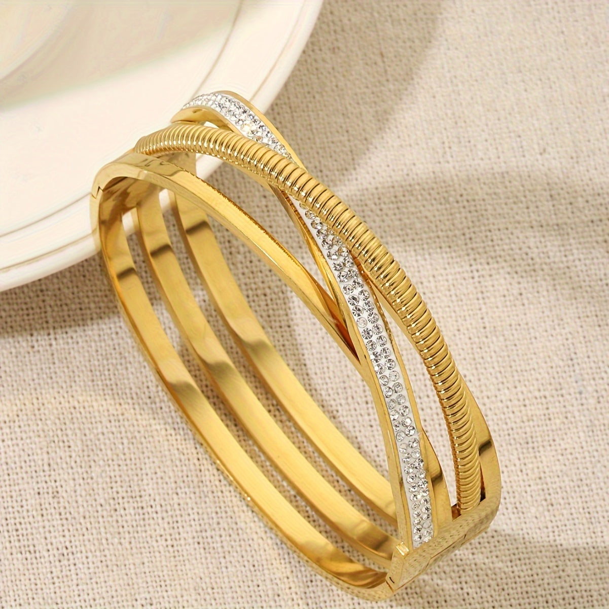 Gold Plated Stainless Steel Triple Strand Bracelet with Cubic Zirconia