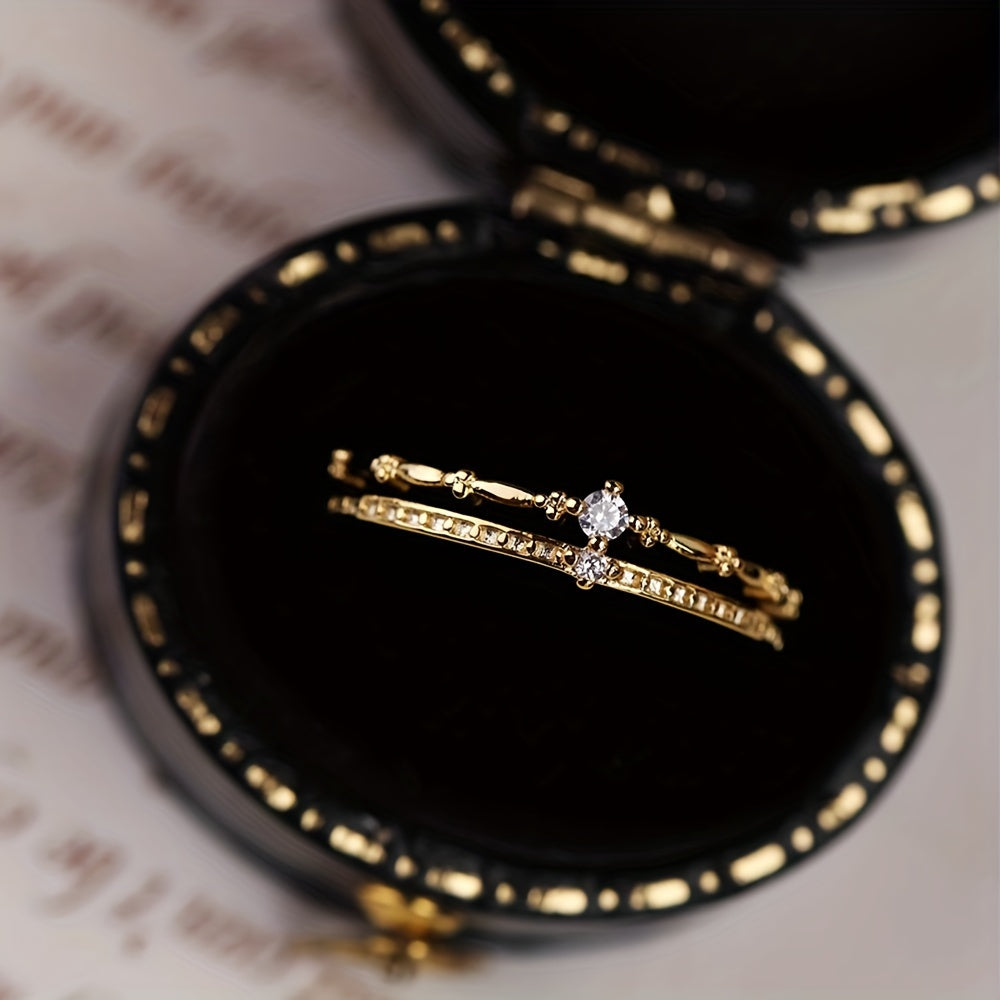 Zarif va chiroyli S925 kumush zirkoni ikki qatlamli toj uzuk, hashamat va retro jozibasi bilan to'la, bu esa uni ayollar uchun 14-fevral yoki har qanday maxsus tadbirda mukammal sovg'a qiladi.