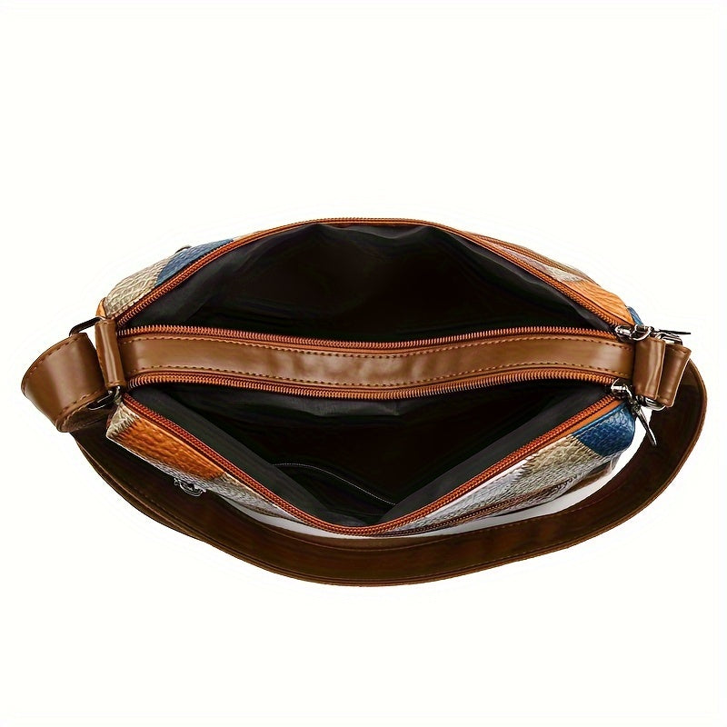 Zamonaviy geometrik naqshli yelka sumkasi keng ichki qismi va fermuari bilan.