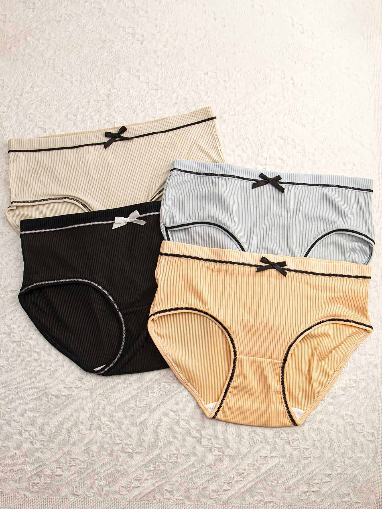 Pack de 4 braguitas de punto transpirable con ribete y diseño de triángulo para mujer