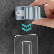 Organizador de pared para sujetar trapeadores y mopas de plástico gris para baño y lavandería