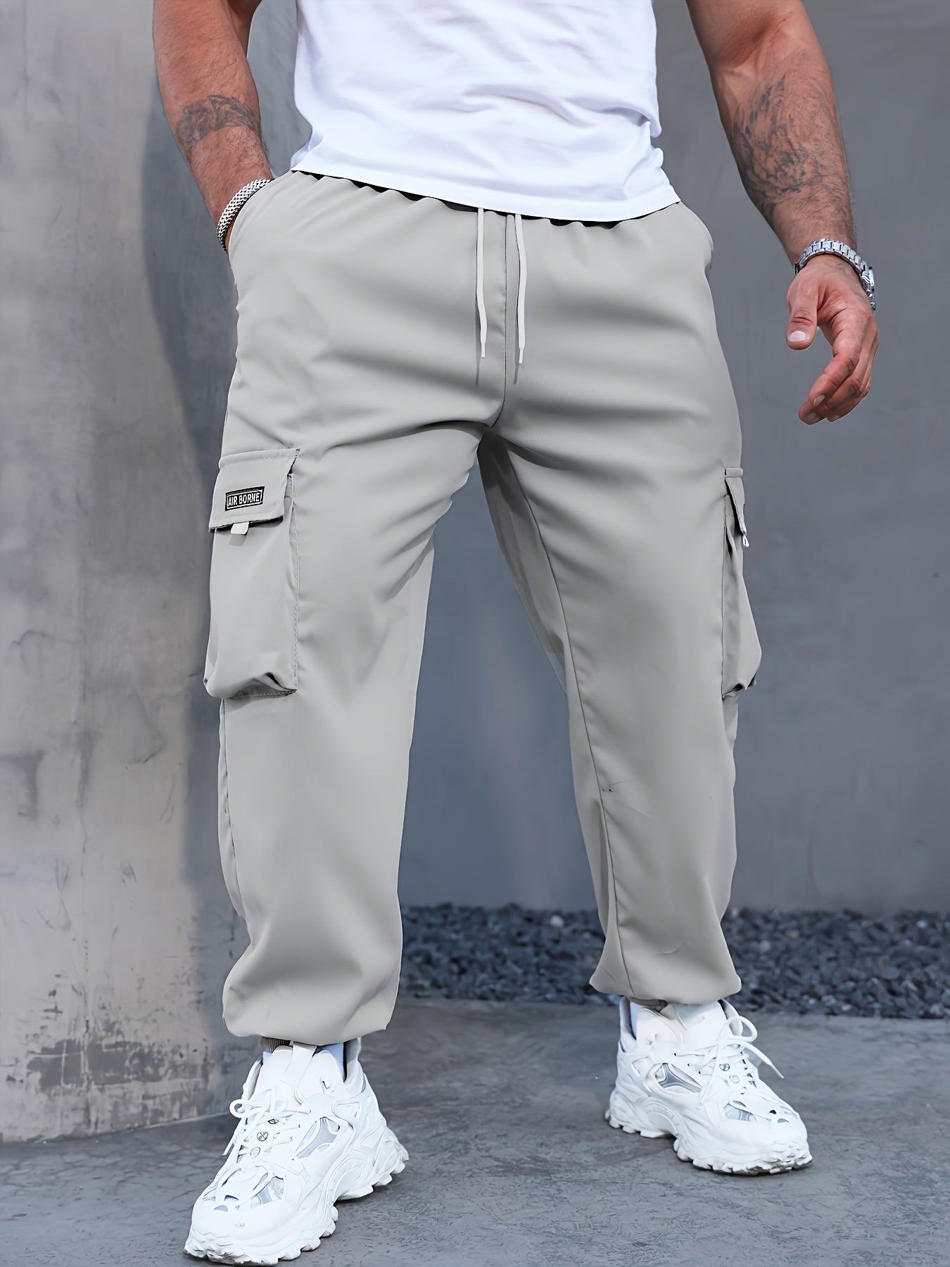 Men's Casual Cargo Pants with Multiple Pockets and Drawstring Tied Feet for Spring 2023