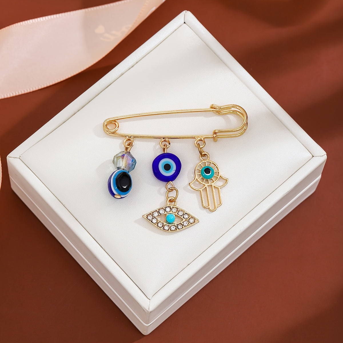 Set of 2 Vintage Crystal Evil Eye Brooches in Blue with Tassels and Cold Wind Detailing