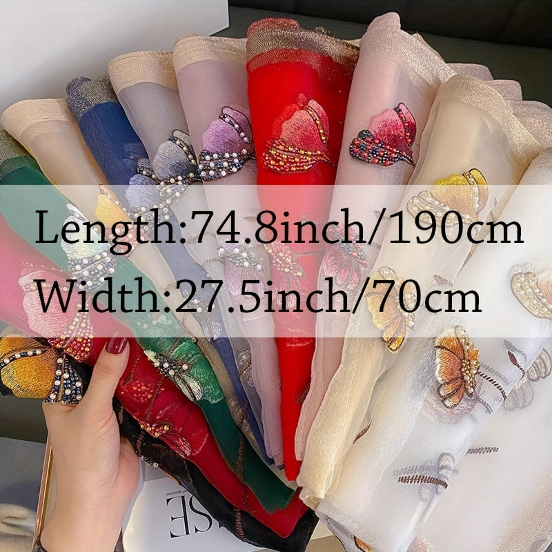 Ipak va jun aralashmasidan tayyorlangan, gullar bilan bezatilgan sharf - kechki tadbirlar uchun ideal.