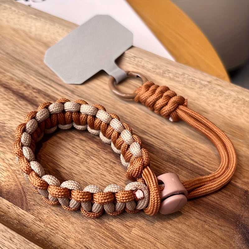Qo'l bilan to'qilgan mobil telefon lanyard, sozlanadigan bilak tasmasi, o'g'irlikka qarshi tushirishni himoya qilish, jasur rang moslashuvi va kuchli metall qisqich. Kameralar uchun mos, universal moslik.