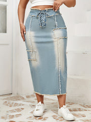 Women's High-Waist Denim Midi Skirt with Frayed Hem and Lace-Up Details in Light to Dark Blue Wash