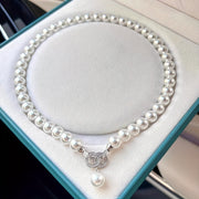 Красивое ожерелье с подвеской в виде двойного круга, украшенное пресноводными жемчугами, изысканный и притягательный стиль, без покрытия - универсальный и стильный аксессуар для повседневной носки.