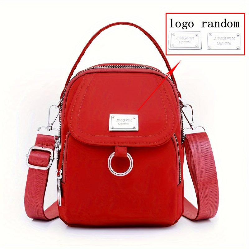 Ayollar uchun nylon crossbody sumka, katta sig'imli, bir rangli, zip yopilishi, polyester astarli, kundalik foydalanish va maxsus tadbirlar uchun ko'p funksiyali, qizil yoki qora ranglarda mavjud.