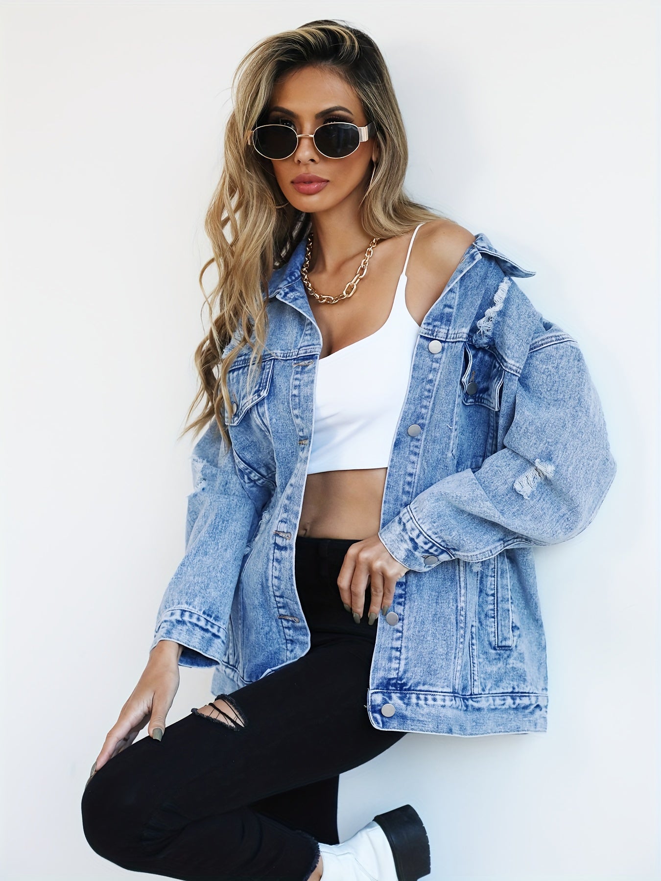 Women’s Light Blue Denim Jacket with Ripped Detailing and Long Sleeves