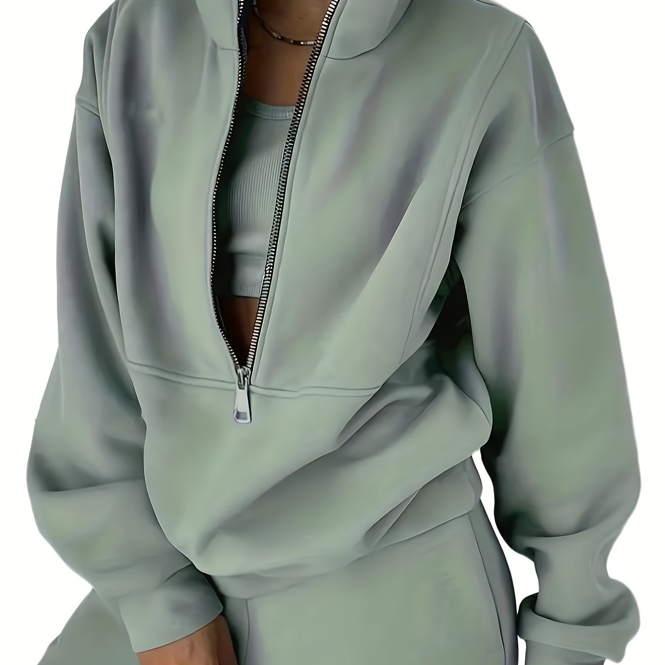 Ayollar uchun zip oldi sviter va elastik belli shimlardan iborat mustahkam ikki qismli to'plam.