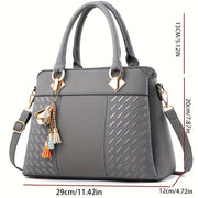 Черная сумка-тоут из змеиной кожи с quilting, молнией и регулируемым ремнем