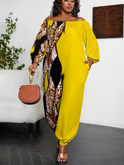 Mono de talla grande bohemio con hombros descubiertos, amarillo vibrante y negro con diseño geométrico