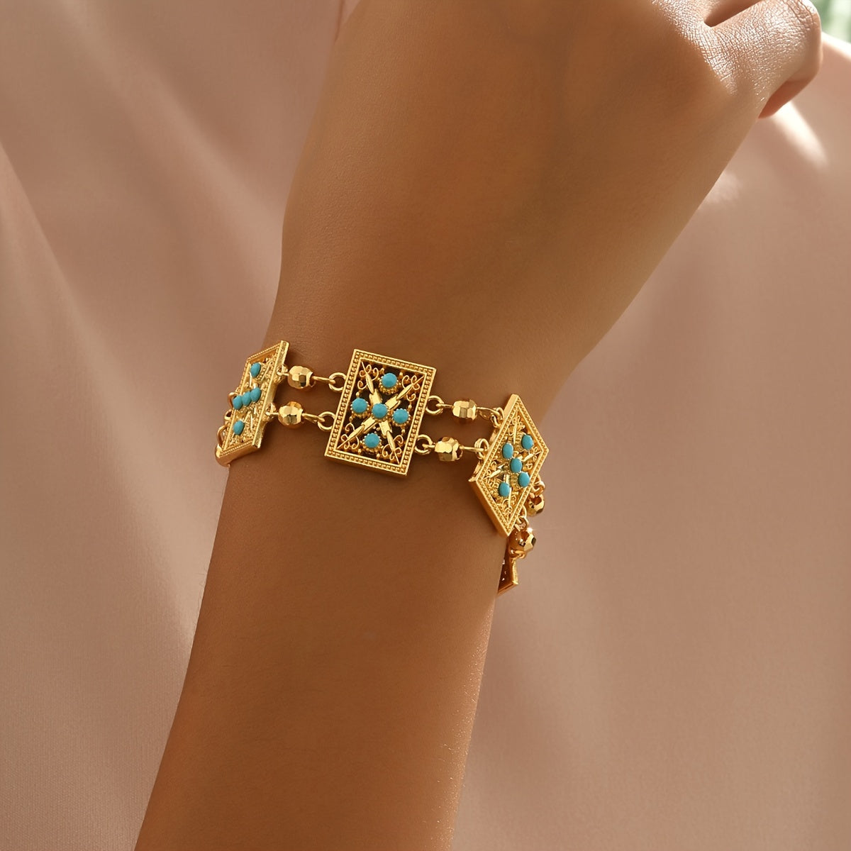 Women’s Gold Plated Alloy Bracelet with Geometric Cut-Out and Blue Cubic Zirconia