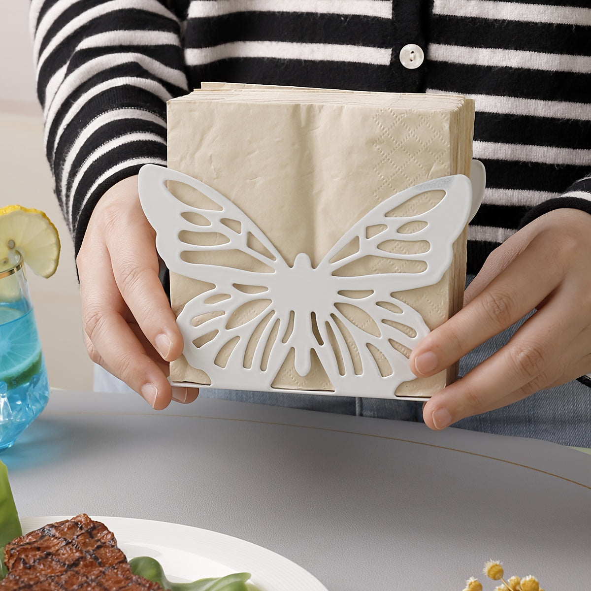 Oyoq shaklidagi metall tishli qog'ozni chiqarish uchun idish oshxona stoli yoki ovqatlanish stoliga