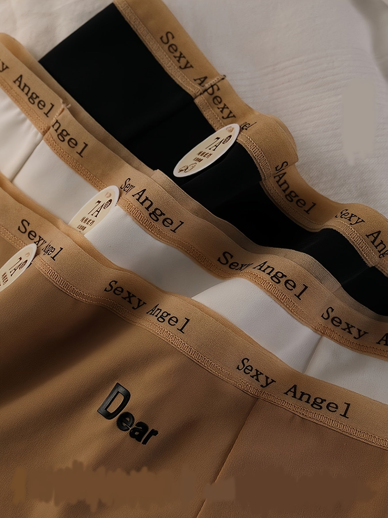 Три комплекта вязаных женских трусиков-треугольников средней посадки.