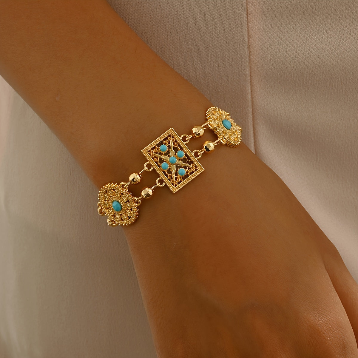 Women’s Gold Plated Alloy Bracelet with Geometric Cut-Out and Blue Cubic Zirconia