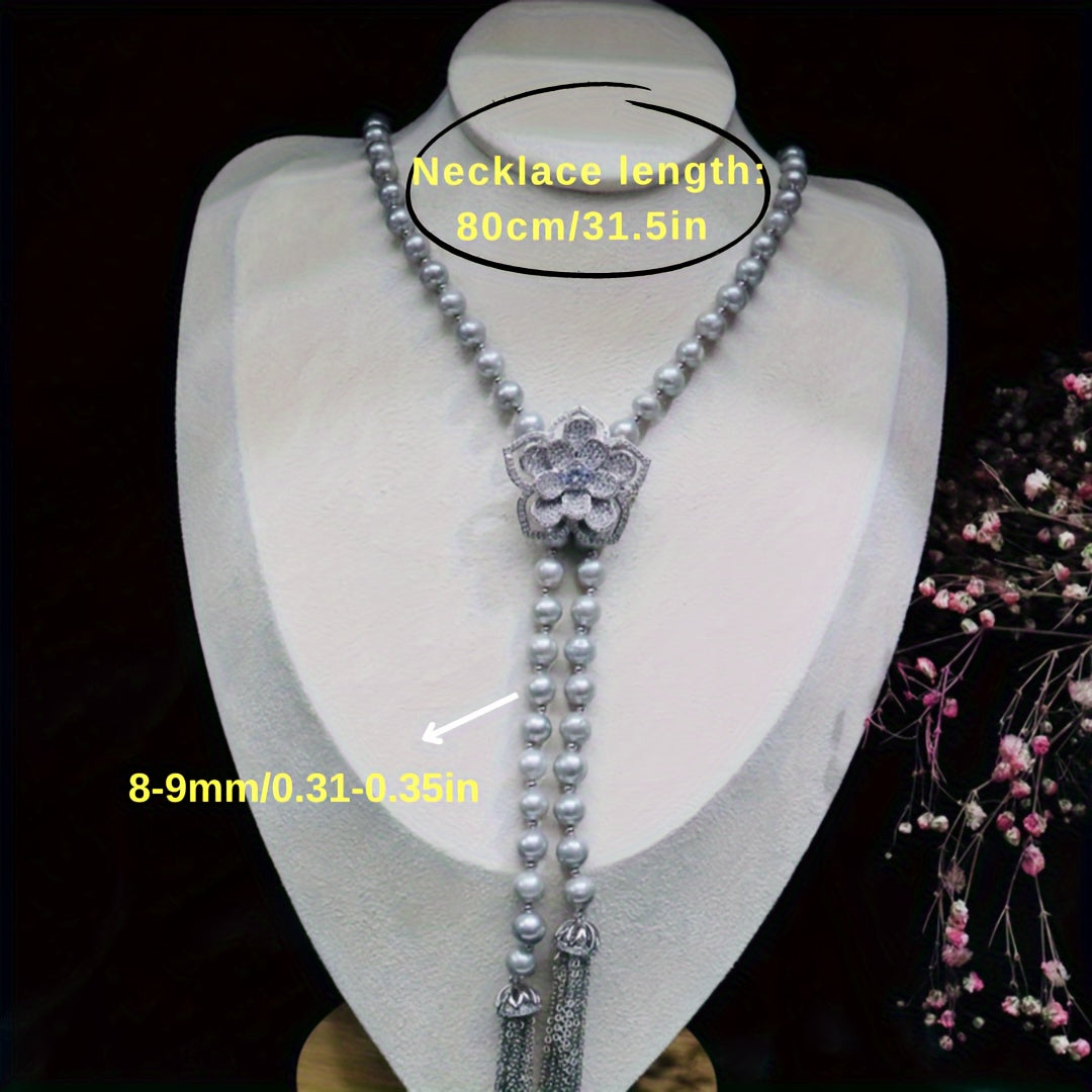 Tabiiy Tinch Oqimli Marjonlar va Gulcha bilan bezatilgan Go'zal Y-Shaped Uzuk, sozlanadigan zanjir bilan ayollar uchun mukammal. Kundalik kiyim va maxsus tadbirlar uchun mos bo'lgan bu uzuk sovg'a qutisida keladi, bu uni mukammal sovg'a qiladi.