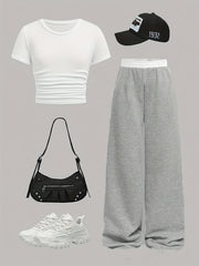 Katta qizlar uchun zamonaviy yon qirqimlar, bir xil rangdagi yuqori qism va to'g'ri oyoq shimlar bilan qulay bahor va yoz ko'rinishi.