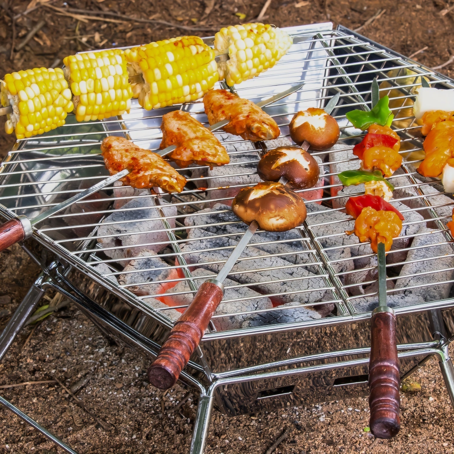 Портативный гриль из нержавеющей стали для барбекю, кемпинга, пикников и приготовления на открытом воздухе. Складной шестиугольный дизайн с регулируемыми ножками и вентиляционными отверстиями.