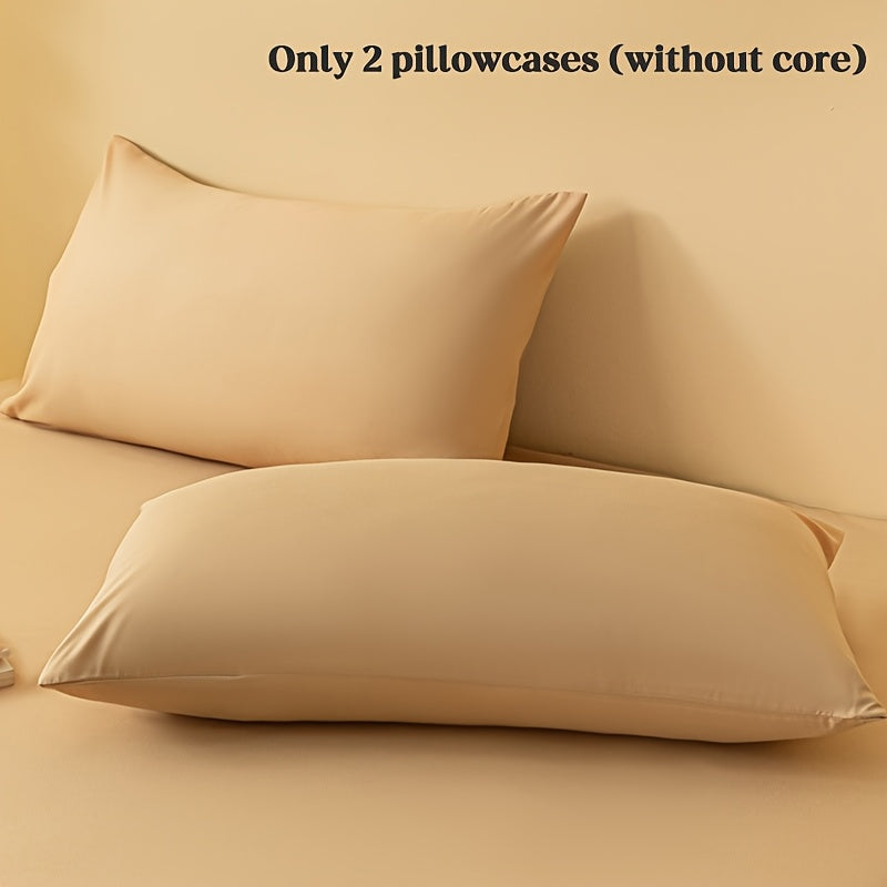 2 ta yostiq qopqog'i, bir rangda, yumshoq va qulay polyester materialidan tayyorlangan, konvert yopilishi bilan, yuvish mashinasida tozalash oson, 90gsm, yotoqxona, mehmonxona yoki mehmonxona to'shagi uchun ideal.