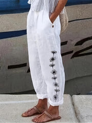 Pantalones harem de talla grande para mujer con estampado de diente de león en negro y bolsillos