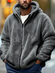 Erkaklar uchun kapüşonli jaket, ichki qismi fleece bilan qoplangan, qish va kuzda ochiq havoda kiyish uchun mos. Sovg'a sifatida ajoyib.