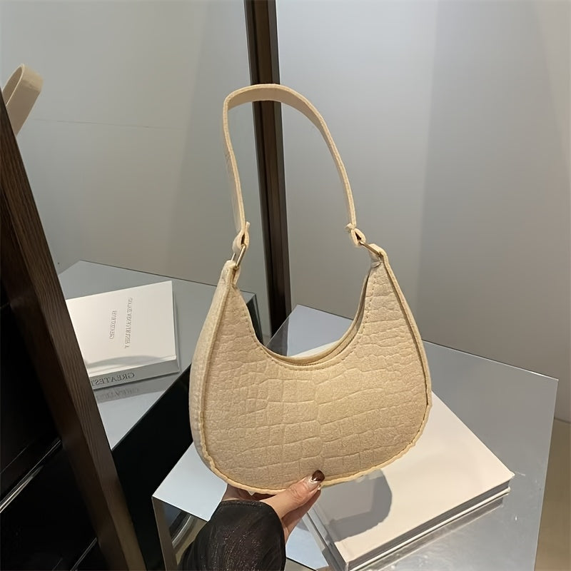 Zamonaviy ayollar uchun yelka sumkasi, clutch aksessuari, zipper yopilishi va o'rnatilgan tasma bilan, har qanday holat uchun ideal.