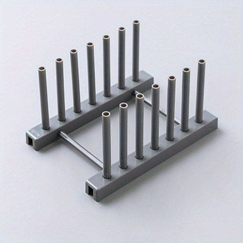 Oson oshxona ish stolida saqlash va idishlarni quritish uchun olib tashlanadigan plastinka ushlagichi va drenaj trayi bilan plastik idish qurituvchi.