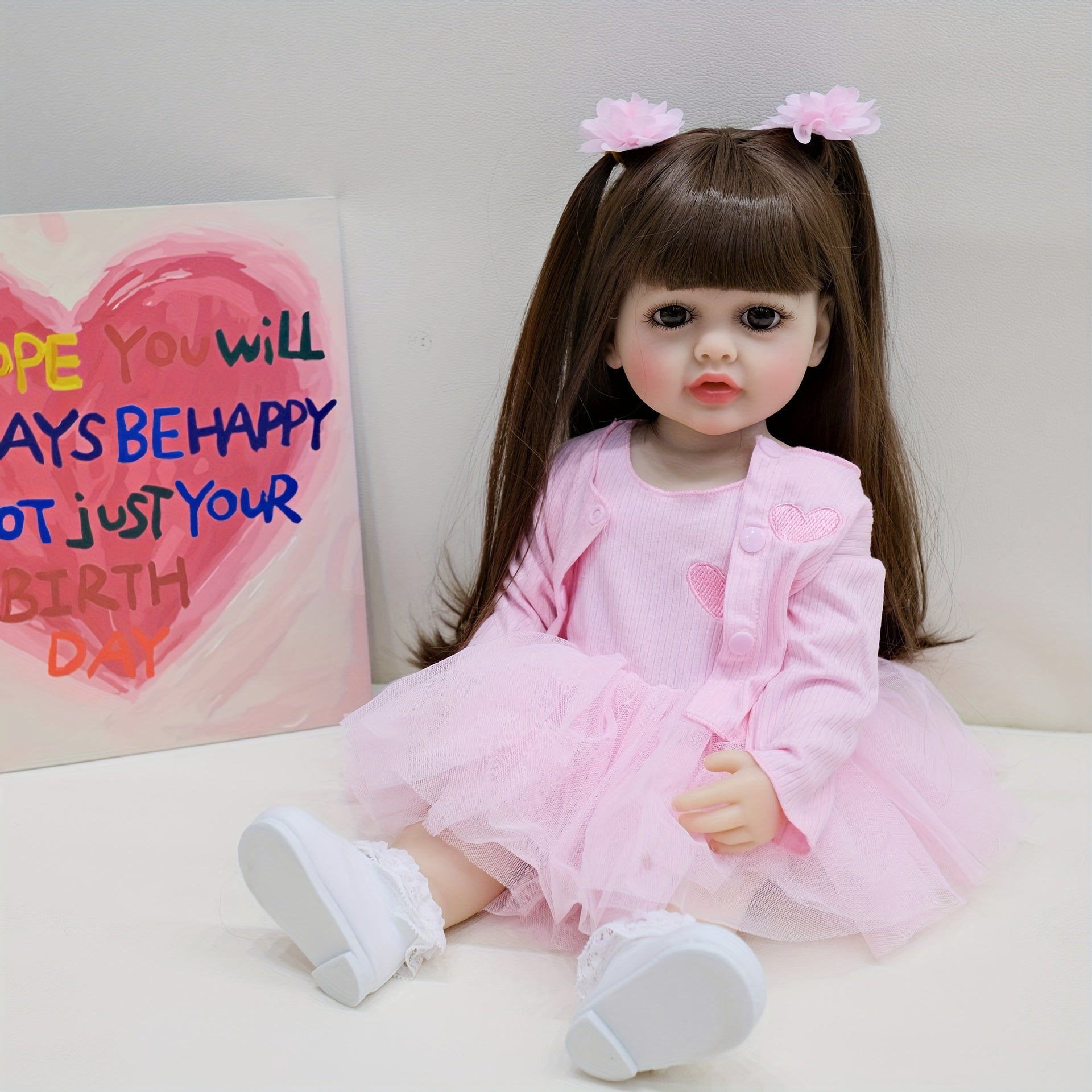 22-Inch Pink Reborn Baby Doll with Long Hair Wig Fully Poseable for Play and Collectors