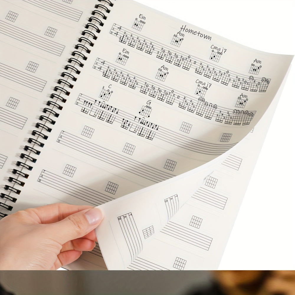 Cuaderno de práctica de guitarra con 50 hojas en blanco con pentagramas y diagramas de acordes
