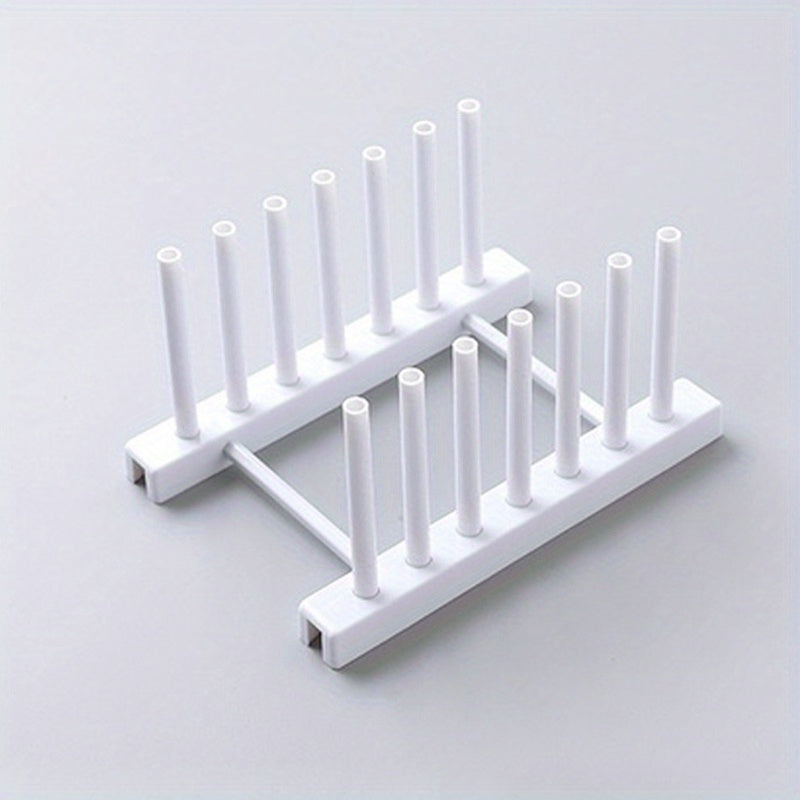 Oson oshxona ish stolida saqlash va idishlarni quritish uchun olib tashlanadigan plastinka ushlagichi va drenaj trayi bilan plastik idish qurituvchi.