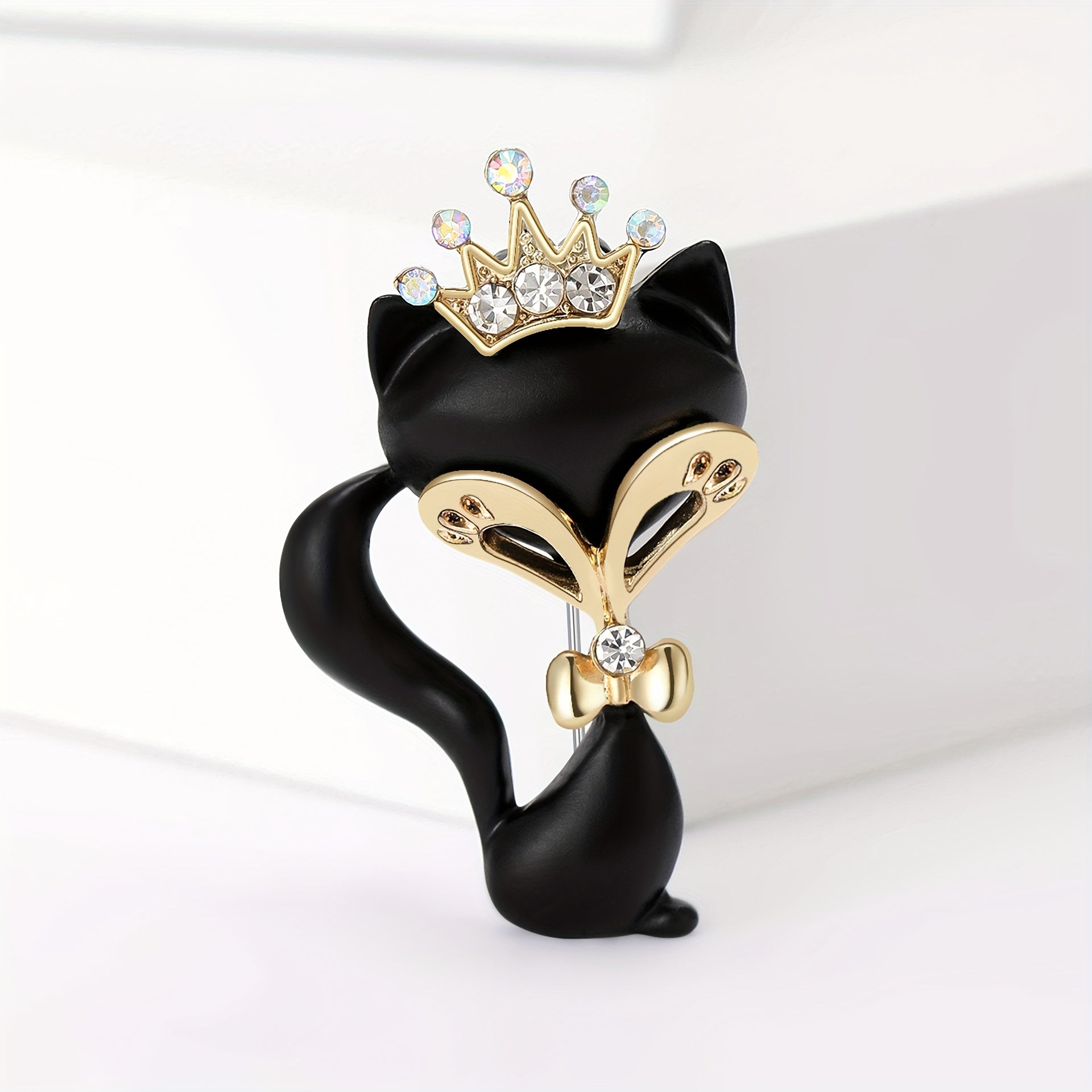 Broche negro mate con corona de rhinestones, accesorio de joyería