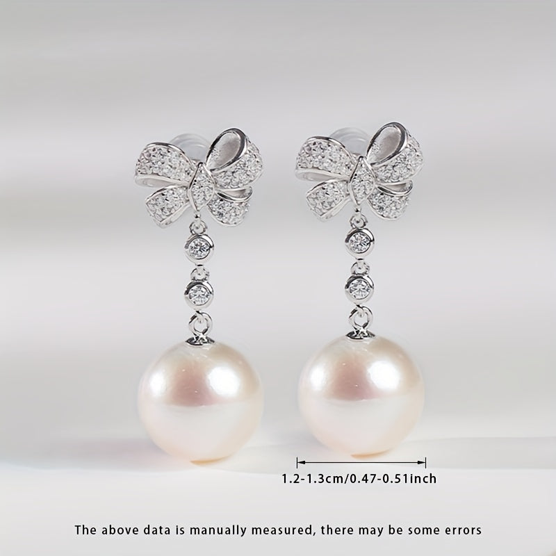 Women's Silver Earrings with Natural Freshwater Pearls and Bow Design