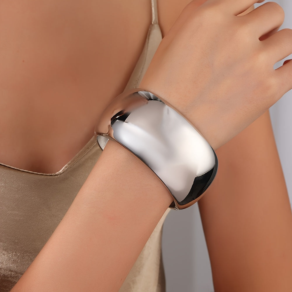 Zarif va silliq zanglamas po'latdan yasalgan baraban bilaguzuk, keng va qalin bangle dizayniga ega. Ushbu ko'p funksiyali moda aksessuari kundalik kiyish yoki sovg'a berish uchun juda mos keladi.