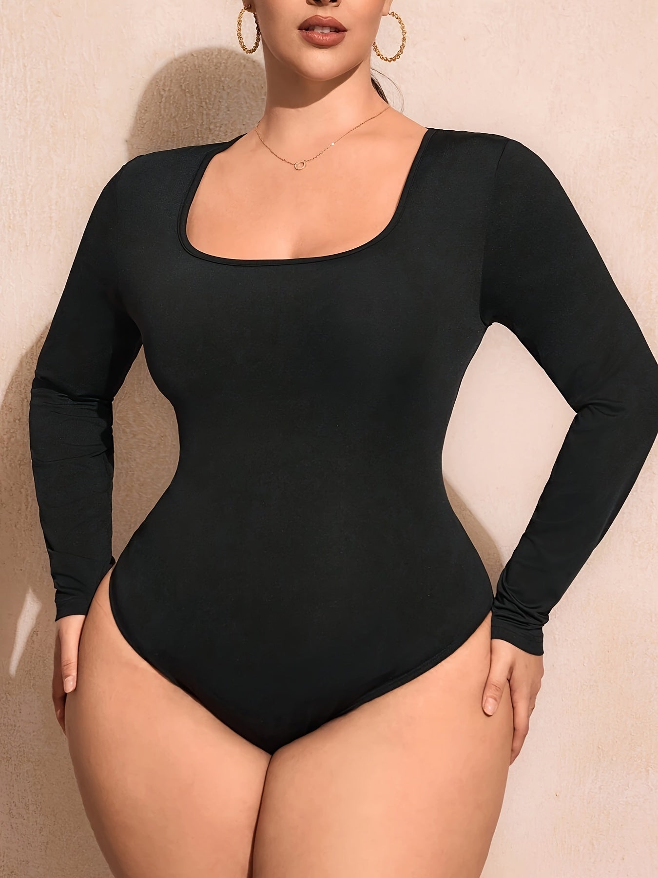 Bodysuit de punto de manga larga de color sólido de talla grande con cuello cuadrado y estilo casual