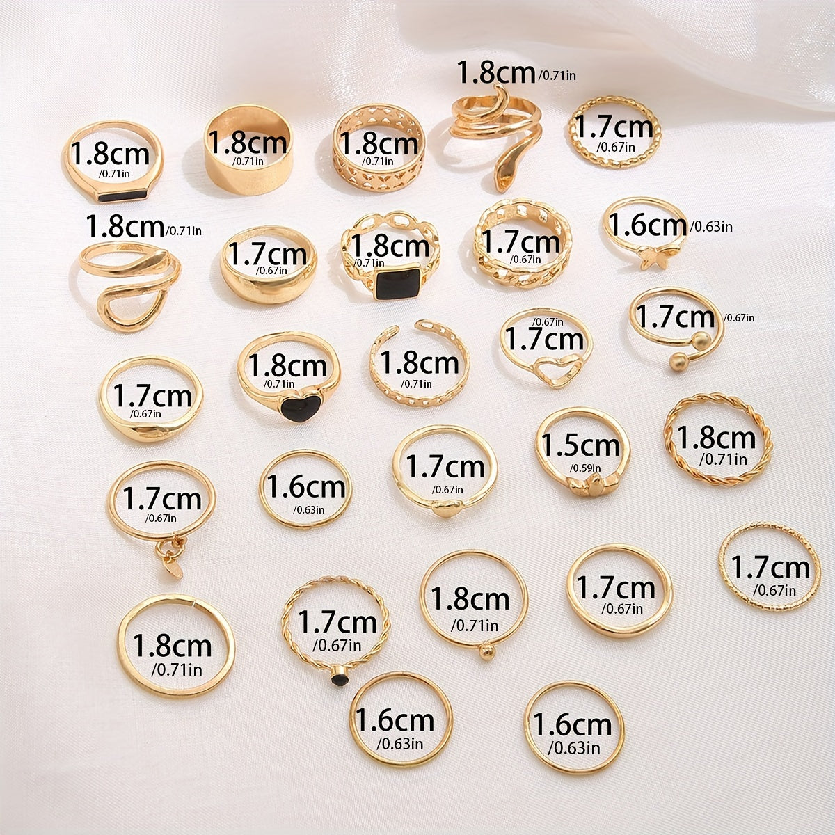 27 dona sink qotishmasidan tayyorlangan vintage to'plamli stackable uzuklar. Yuraklar, kapalaklar, ilonlar, tomchilar, geometrik shakllar, disklar, bo'sh zanjirlar va keng yuzalar kabi turli dizaynlarni o'z ichiga oladi.