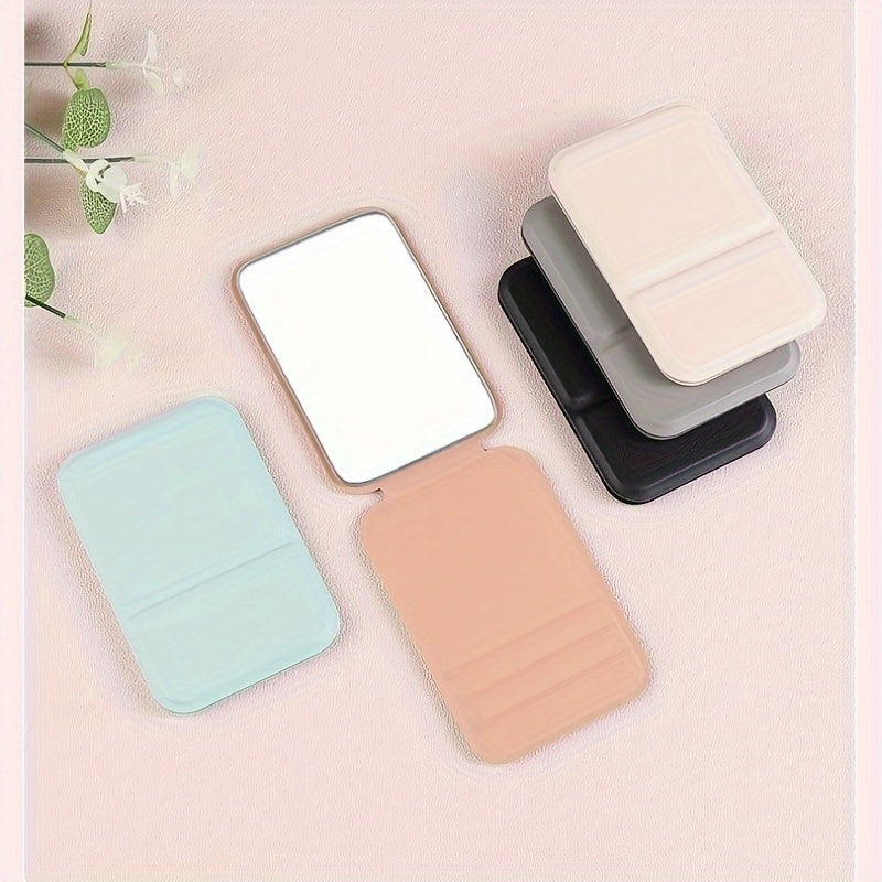 Espejo de maquillaje de mano plegable con espejo compacto de viaje de cuero PU de color sólido