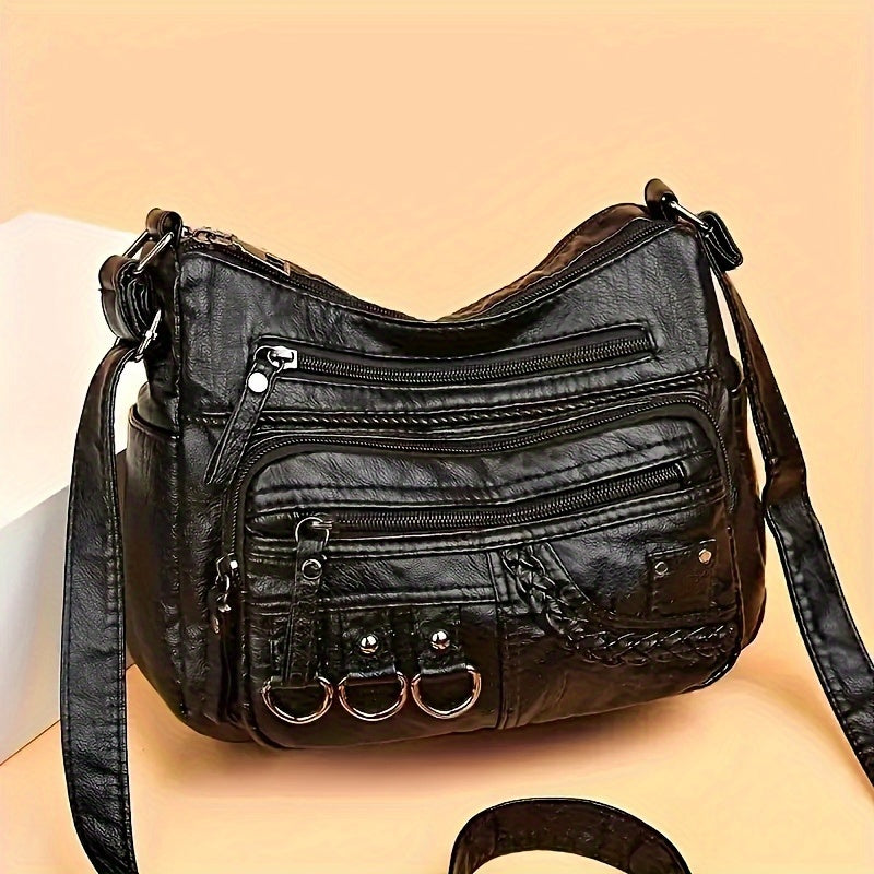 Ayollar uchun qora crossbody sumka, ziplar va polyester ichki qismi bilan