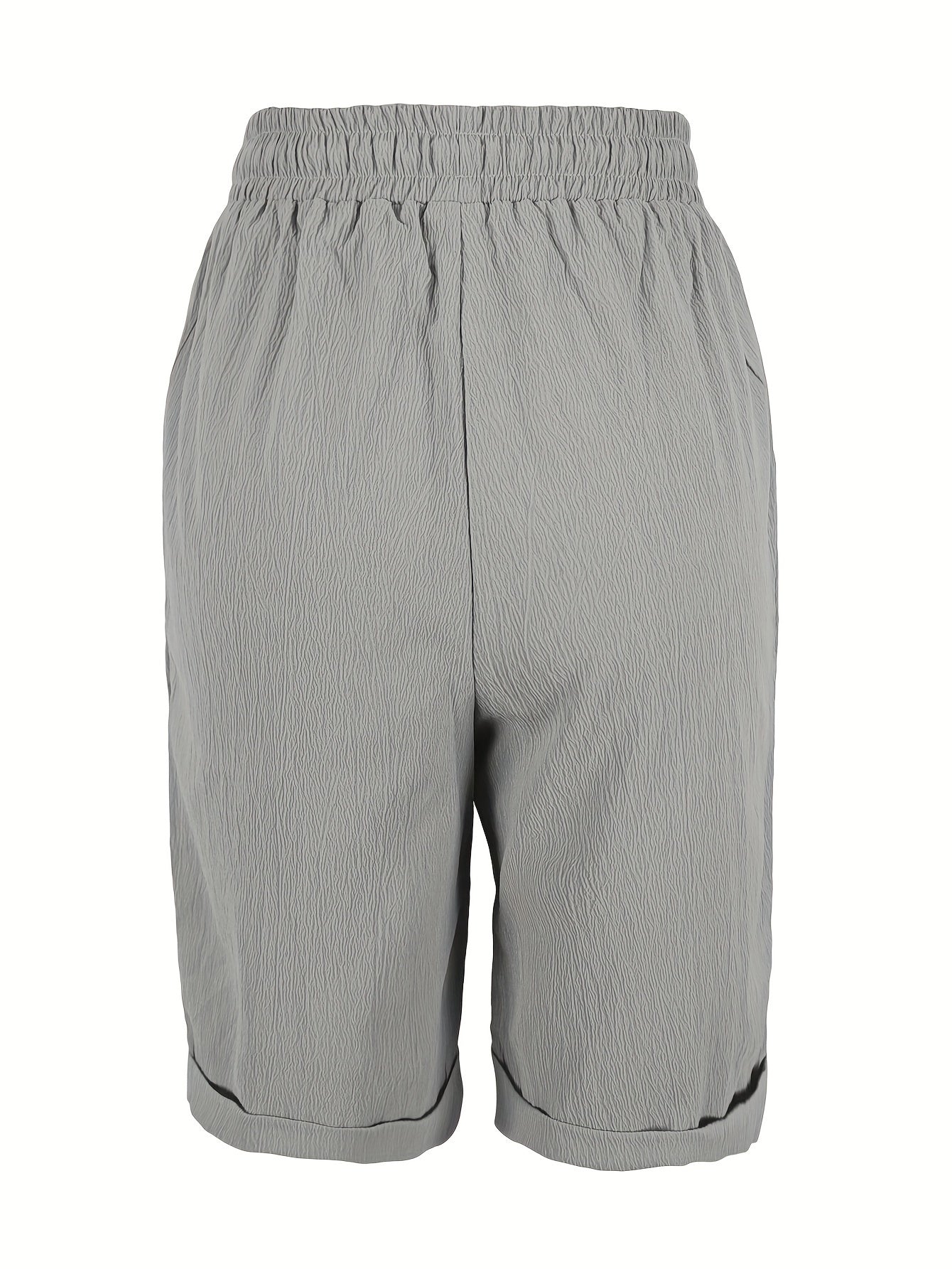 Ayollar uchun bir rangli Capri shimlar, bezakli tugma va chiziqli belbog' bilan