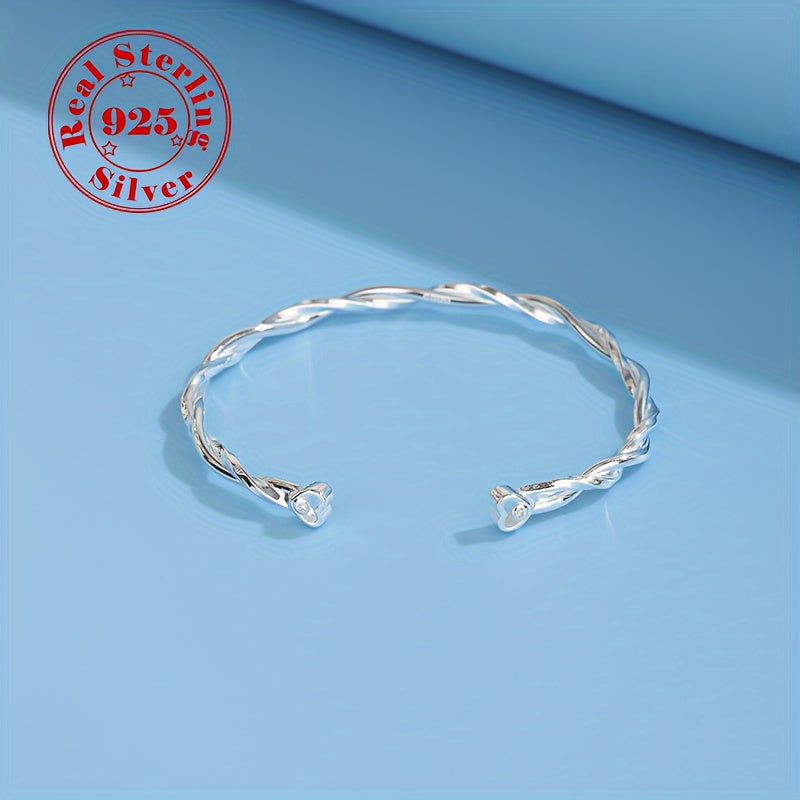 Women's Silver Twisted Möbius Band Bracelet with White Gold Plating and Zirconia
