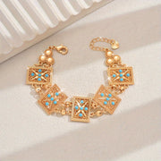 Women’s Gold Plated Alloy Bracelet with Geometric Cut-Out and Blue Cubic Zirconia