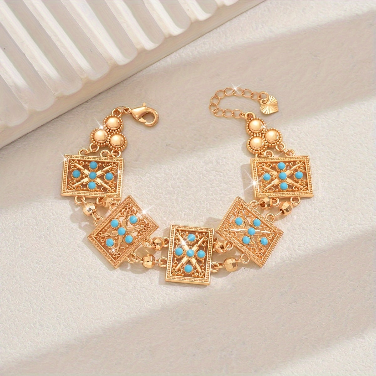 Women’s Gold Plated Alloy Bracelet with Geometric Cut-Out and Blue Cubic Zirconia