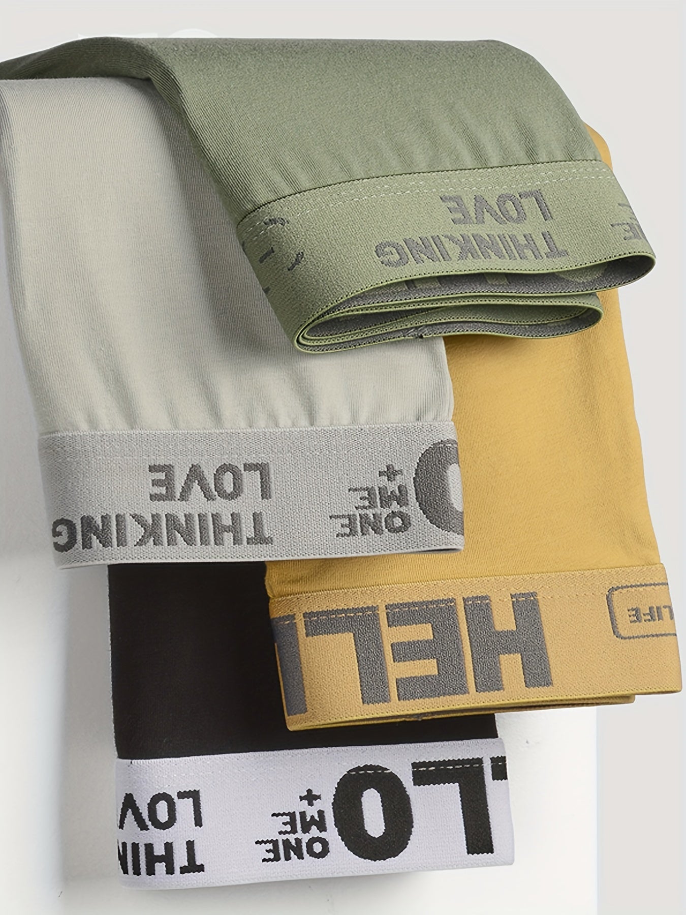 10 ta erkaklar uchun "HELLO" bokser shortlari, 95% polyester va 5% spandeksdan tayyorlangan, yuqori cho'ziluvchan to'qima bilan bir rangda. O'ziga xos va qulay, kundalik kiyish uchun.