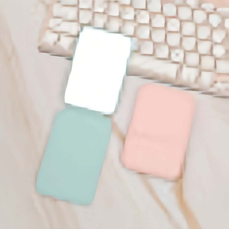 Espejo de maquillaje de mano plegable con espejo compacto de viaje de cuero PU de color sólido