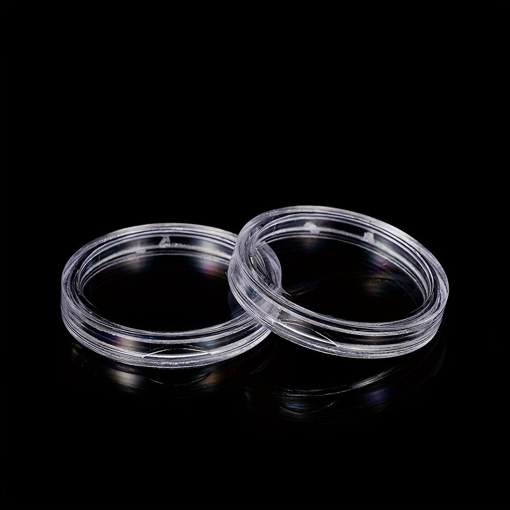 Прозрачные коробки для защиты монет доступны в упаковках по 25, 50 или 100 штук. Подходят для коллекционных предметов размером 19-33 мм, идеально подходят для памятных монет и медалей.