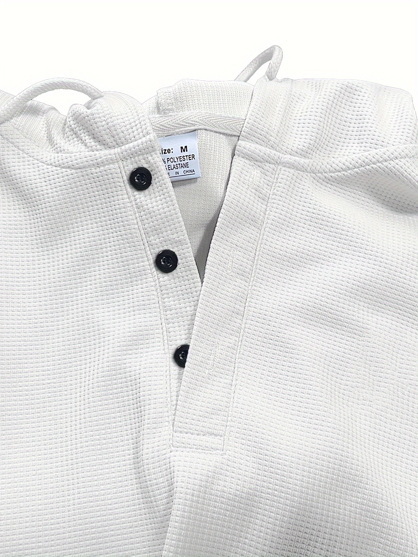 Erkaklar uchun bir rangli vafli to'plami, kapüşonli va tortish ipli shimlar bilan, bahor va kuzda ochiq havoda faoliyatlar va tasodifiy kiyimlar uchun ideal.