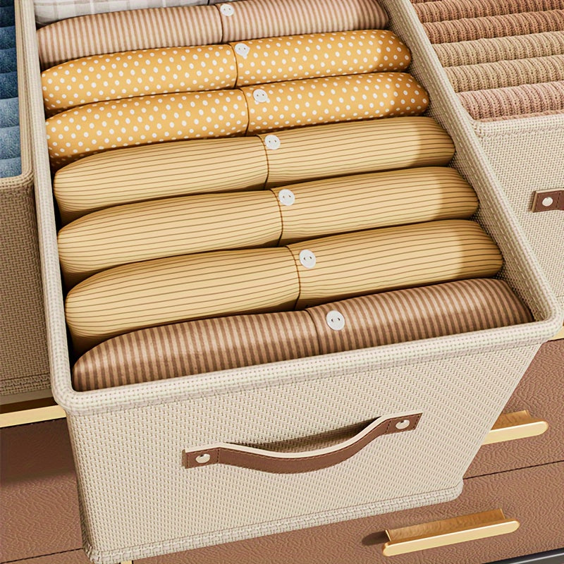 Qo‘lqopli to‘g‘ri burchakli saqlash qutilari, shkaflar yoki yotoq javonlari uchun mukammal. Ushbu yig‘iladigan mato qutilar kulrang yoki bej rangda bo‘lib, joyingizni tartibga solishda ideal. Yotoq osti saqlash uchun ham juda yaxshi!