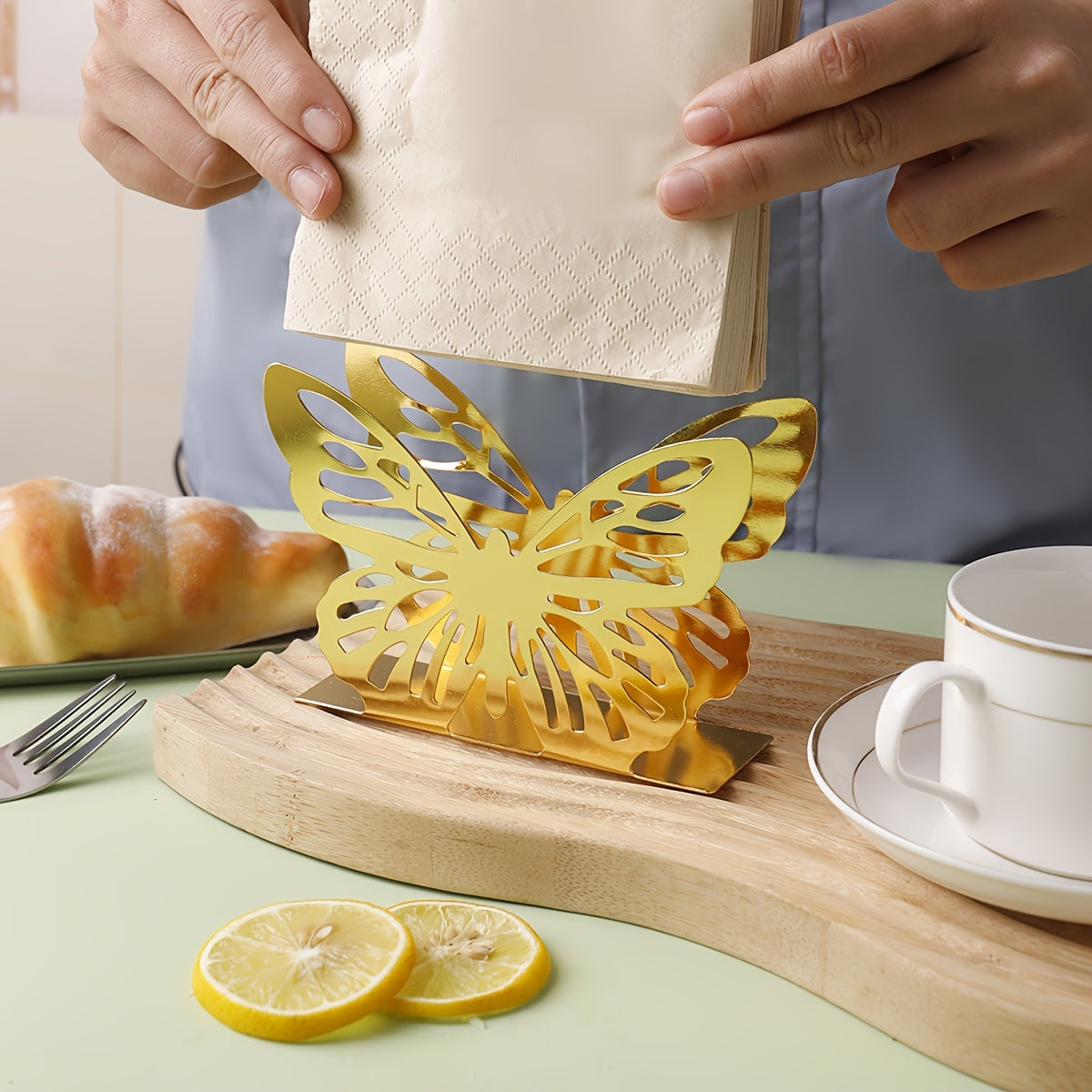 Oyoq shaklidagi metall tishli qog'ozni chiqarish uchun idish oshxona stoli yoki ovqatlanish stoliga